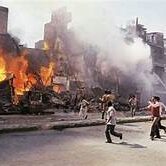 Sikhs properties set ablaze and left-Sikhs lying dead in Delhi during 1984 Sikh Genocide